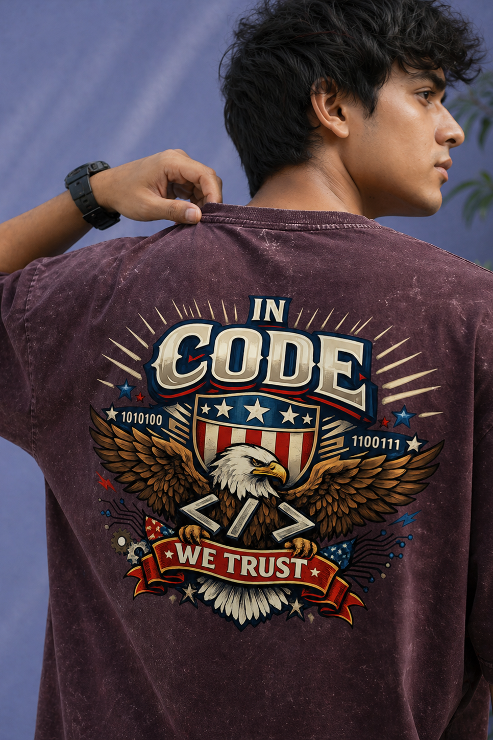 Person wearing a maroon t-shirt with a graphic design on the back, featuring an eagle and text.