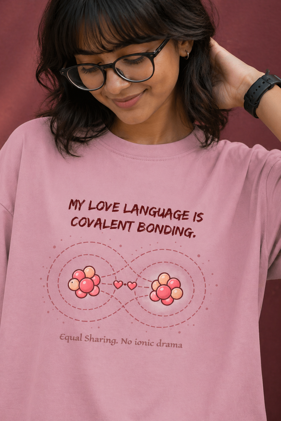 Person wearing a pink t-shirt with a humorous quote about love language.